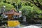 Small traditional Balinese temple wrapped in sacred yellow cloth