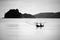 Small traditional fishing boat alone on the sea in black and white picture style