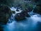 Small traditional wooden water mill by the wild river Krupa with big rocks and cascades on popular tourist place Krupa na Vrbasu