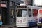 Small tram of HTM on track in downtown Den Haag The Hague in the Netherlands. This GLT tram have a plastic nose for safety.