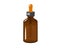 Small transparent bottle of essential oil with dropper