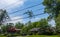 A small tree branch seen stuck in electric wires over a street after a storm