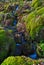 Small trickle of water flowing over moss soaked rocks by the Watkins path, Snowdon