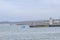 Small turquoise fishing boat returning to Buckie, Moray, Scotland port under a hazy weather