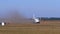 Small Twin-Engine Airplane moves along the Runway with a Ground Cover