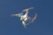 Small unmanned helicopter with a camera floating in the sky