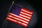 Small US American Flag on Smoky Black Background