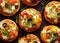 Small vegetarian pizzas with the addition various kinds of vegetables , mozzarella cheese and fresh basil