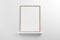 Small vertical wooden frame mockup in scandinavian style interior on a shelf on empty neutral white wall background. 3d rendering