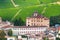 Small village castle Barolo among vineyards