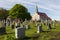 Small village cemetery and patrimonial neoclassical 1737 stone catholic church in Saint-Jean, Island of Orleans