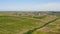 A small village in the valley surrounded by fields of vineyards