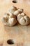 Small walnuts breads on a wooden old cutting board