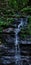 A small water fall in the middle of a forest in Ponmudi, Kerala, India