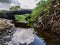 Small water lake with rock