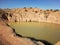 Small water lake at semi precious gems mostly sapphire mine at Ilakaka, Madagascar