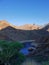 A small water reservoir hidden in the shadows of the mountains on Tenerife, Canary Islands