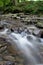 Small waterfal with stones, long exposure