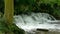 Small waterfall at Acquigny castle garden, France