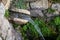 A small waterfall that falls into an ancient storage pool