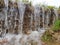 A small waterfall. Flowing water erodes the soil