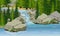 Small waterfall in the forest. Lake, large stones, spruce trees