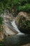 A small waterfall in the forest located in Mount Stong, Kelantan, Malaysia.