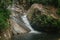 A small waterfall in the forest located in Mount Stong, Kelantan, Malaysia.