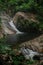 A small waterfall in the forest located in Mount Stong, Kelantan, Malaysia.