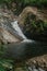 A small waterfall in the forest located in Mount Stong, Kelantan, Malaysia.