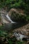 A small waterfall in the forest located in Mount Stong, Kelantan, Malaysia.