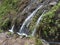 Small waterfall at mysterious Laurel forest Laurisilva, lush subtropical rainforest at hiking trail Los Tilos, La Palma