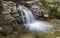 A small waterfall and river on the hike to Millard Falls