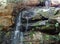 Small waterfall among rocks. Located in the forests of the city of Esmeraldas.