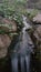 Small Waterfall Rushing Over Rocks