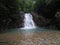 a small waterfall that is still beautiful and natural