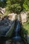 A small waterfall in Vorontsov park on a sunny day, Crimea