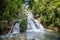 Small waterfall in the wild forest.