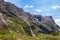 Small waterfalls and streams from sheer cliffs on the way to Fiordland. New Zealand