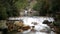 Small waterfalls of transparent water inside the mountain