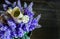 A small watering can on the artificial lavender