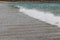 Small wave with seafoam shot at shallow depth of field on a warm summer day in Tasmania