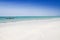 Small waves crushing on the beach. Ngalawa fishing boat in Zanzibar