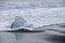 Small waves lap op Ice Floes on the Icelandic shore