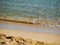 Small waves on a nice empty sandy beach - crystal clear water