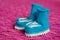 Small white-blue children`s knitted booties