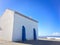 Small white church in portugal on a sunny day, blue sky, combination of white and blue, place of prayer