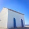 Small white church in portugal on a sunny day, blue sky, combination of white and blue, place of prayer