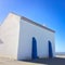 Small white church in portugal on a sunny day, blue sky, combination of white and blue, place of prayer, religious building