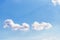 Small white clouds like a wings on blue sky background